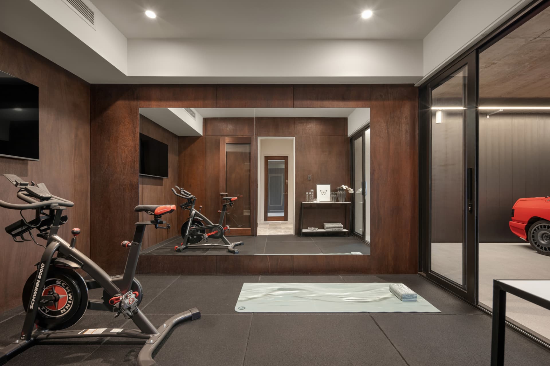 Private home gym adjoining the showroom garage