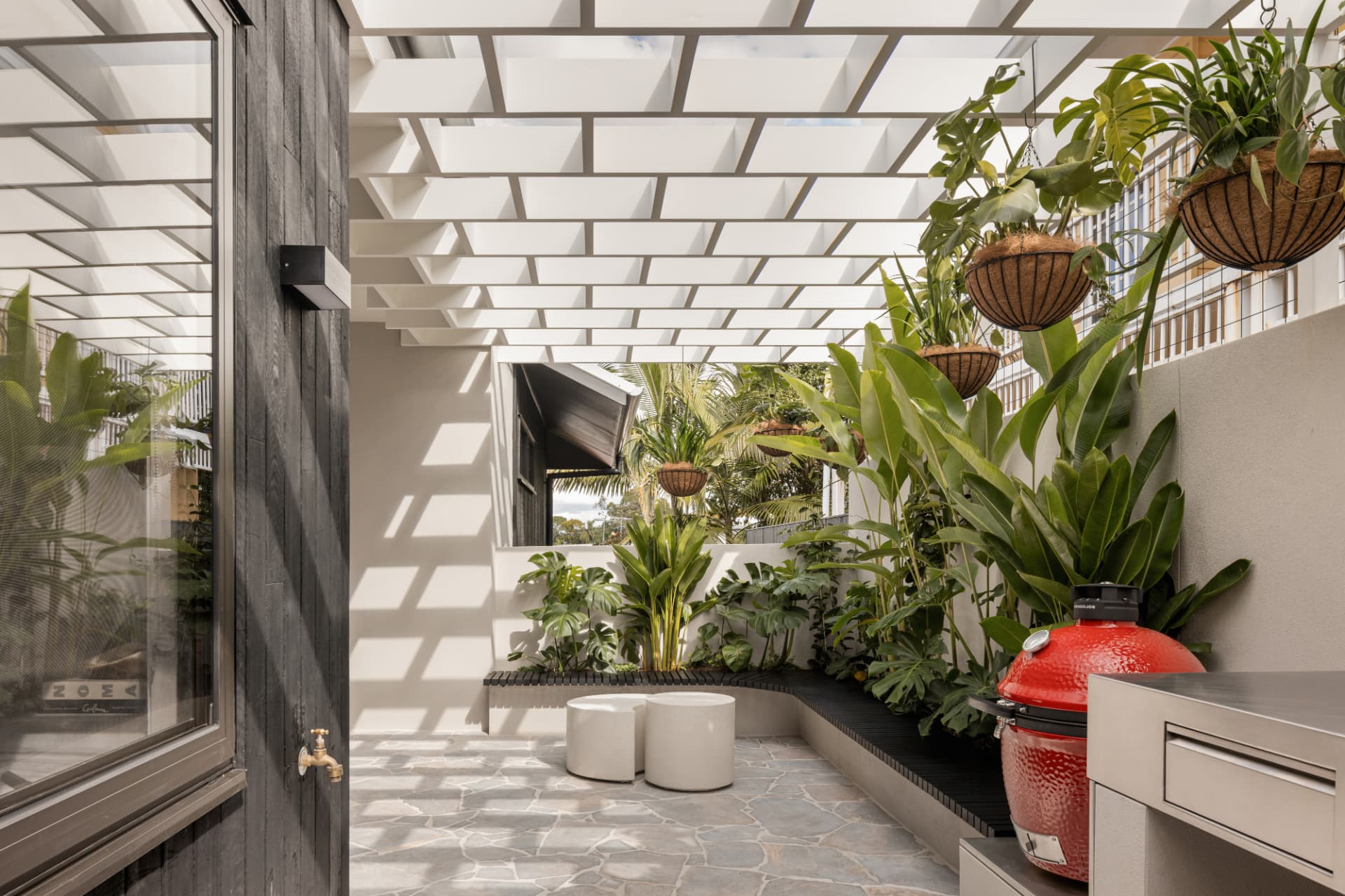Sheltered courtyard with battened pergola