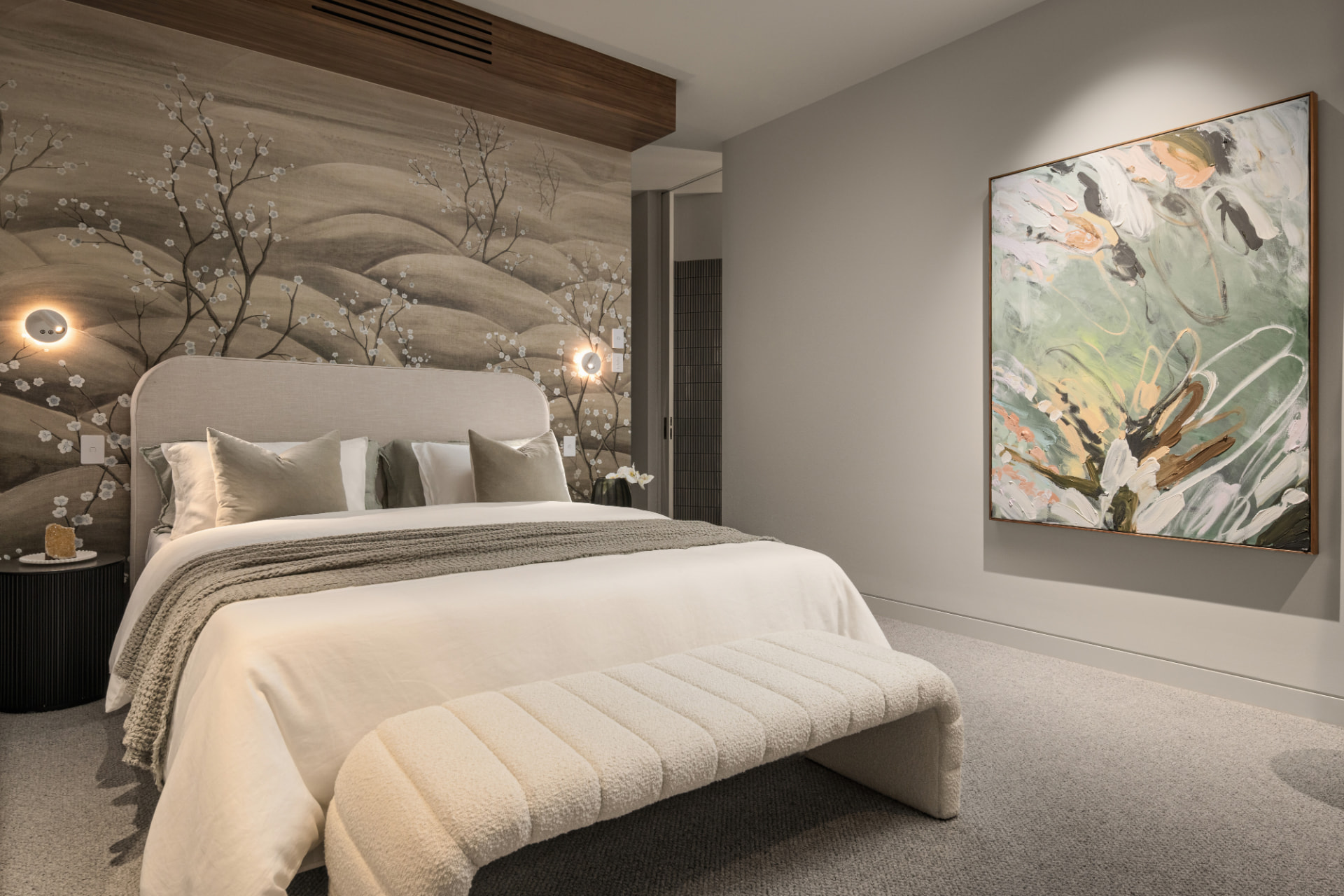 Bedroom with hand-painted blossom mural and bespoke bedhead