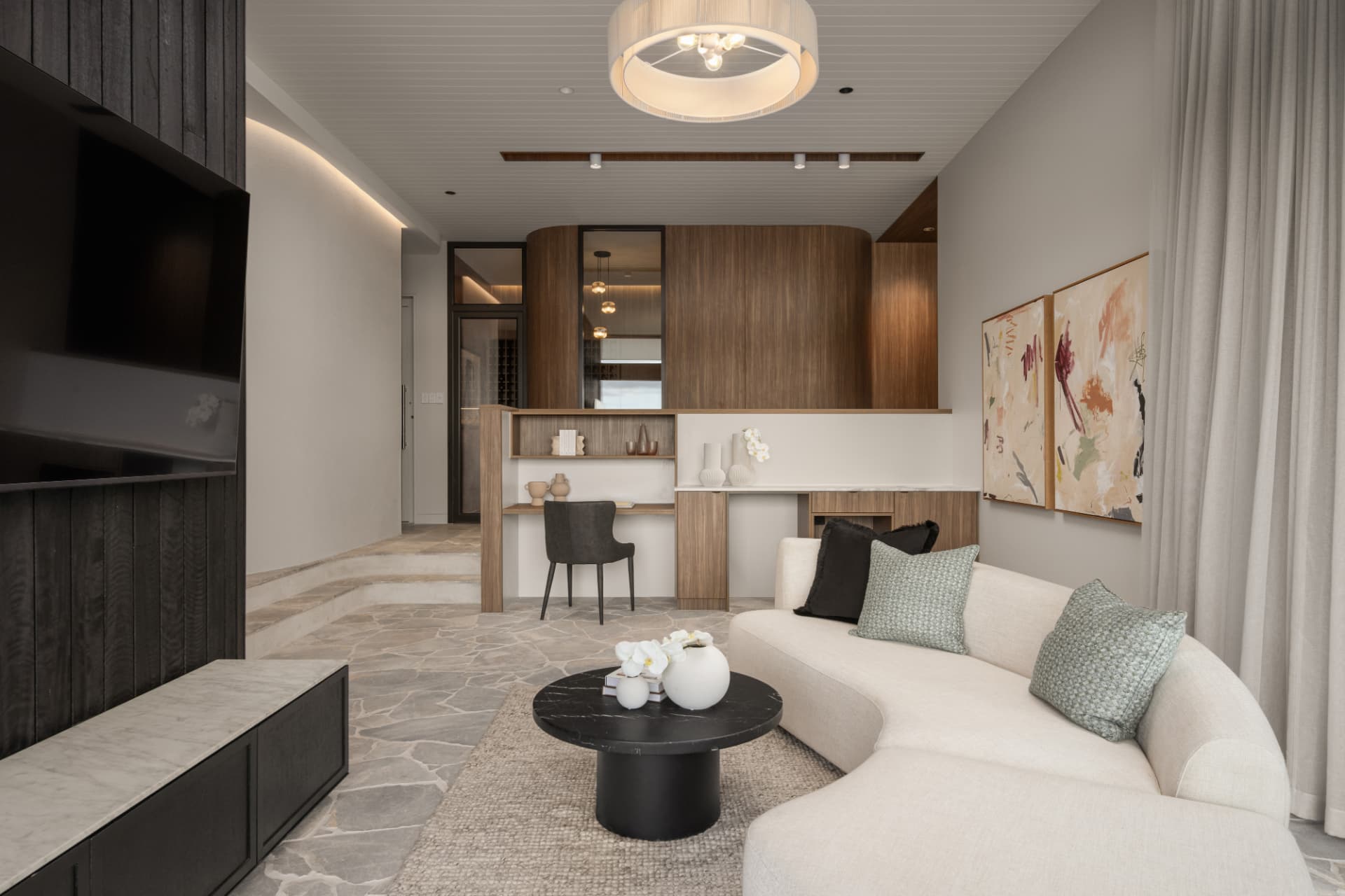 Media lounge with charred timber wall and bespoke study nook